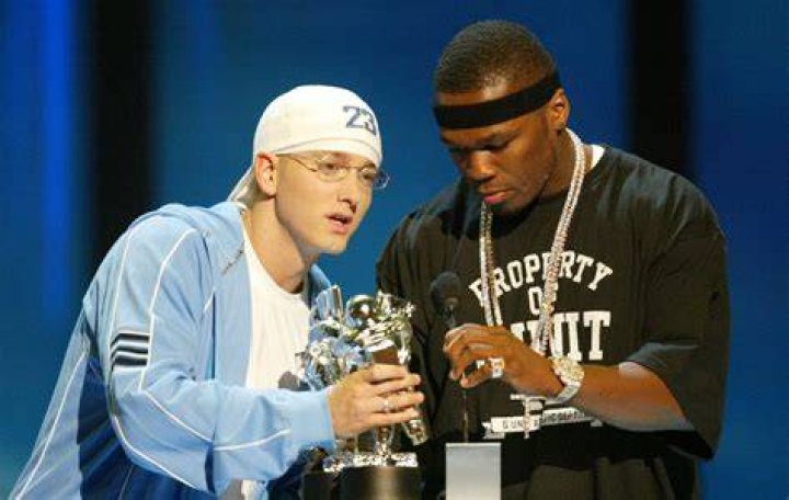 50 Cent and Eminem take a photo together at a ceremony honoring 50 with a star on the Hollywood Walk of Fame
