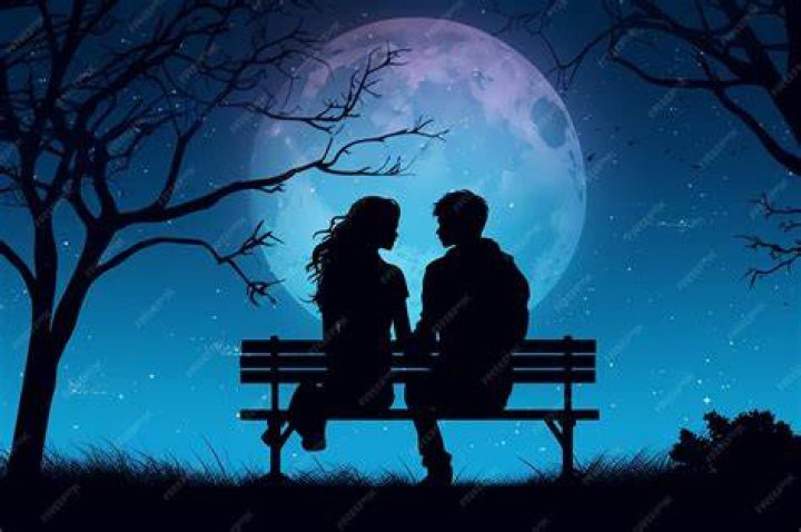a man and woman sitting on a bench