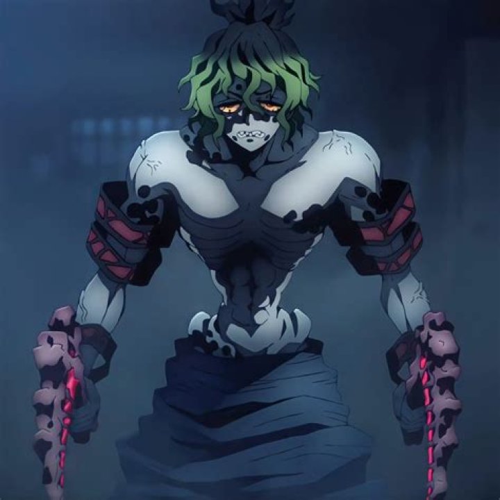Gyutaro in 'Demon Slayer' Season 2's Entertainment District Arc. He has green hair and sharp teeth.