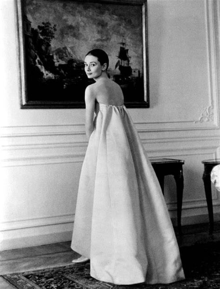 Audrey-Hepburn,-Breakfast-at-Tiffany's,-PARAMOUNT-BUD-FRAKER-THE-KOBAL-COLLECTION <p>Audrey Hepburn wears a Givenchy designed long black sleeveless cocktail dress in Breakfast At Tiffany's.</p>