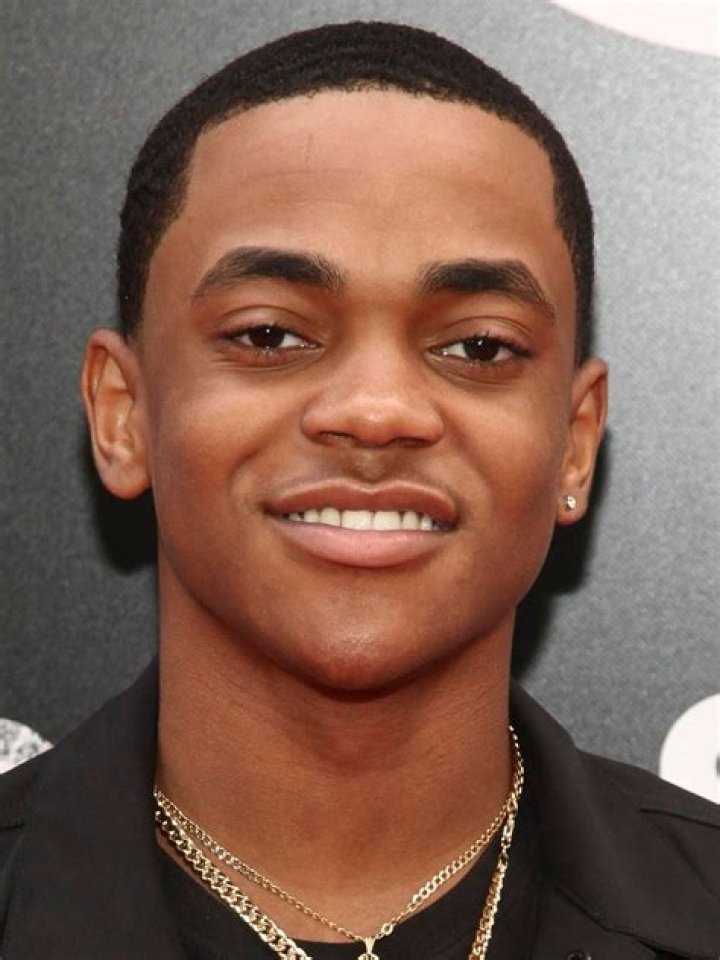 Michael Rainey Jr. in a purple sweater