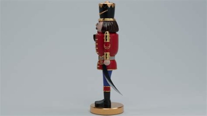 What does the Nutcracker hold in his hand?